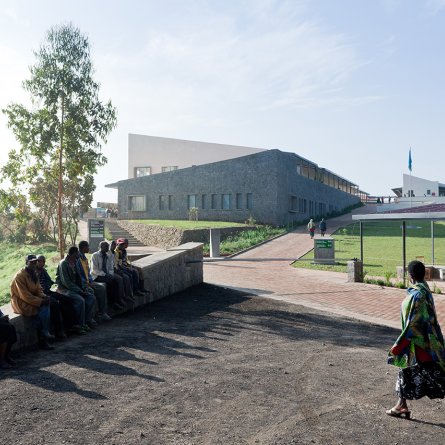 Photo of the Butaro District Hospital,  Photo by Iwan Baan, Front Entrance with Community Members