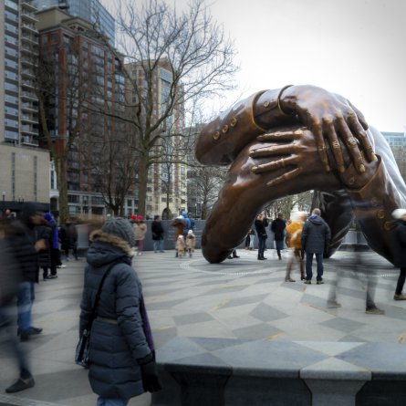 The Embrace. Visitors gather around the Memorial on MLK Day