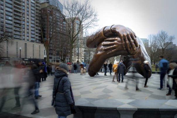 The Embrace. Visitors gather around the Memorial on MLK Day